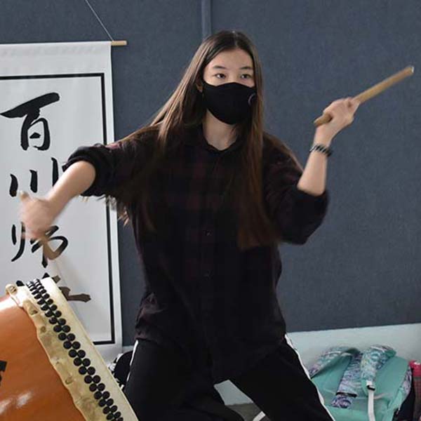 image of student playing Taiko drums